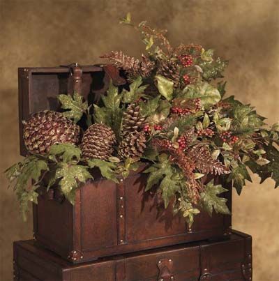 Wooden trunks filled with Pine Cones and Greenery